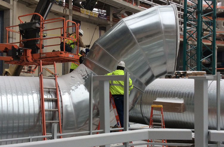 Installation of the massive ductwork in progress.