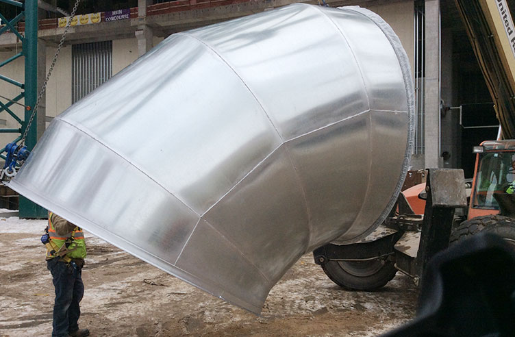 Man next to ductwork